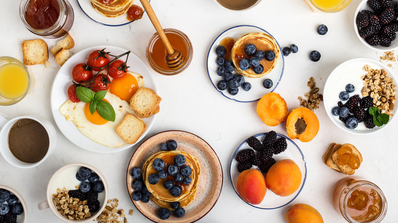 eggs, pancakes, and fruit arrangement