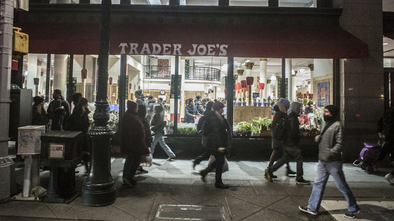 Exterior of a Trader Joe's location in NYC behind a busy sidewalk