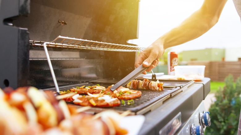 Person grilling meat