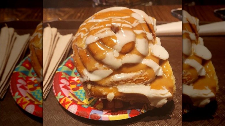 Gaston's Tavern Cinnamon roll on a paper plate