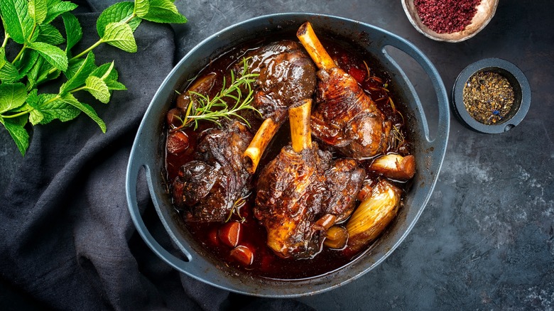 Dish with roasted lamb shank