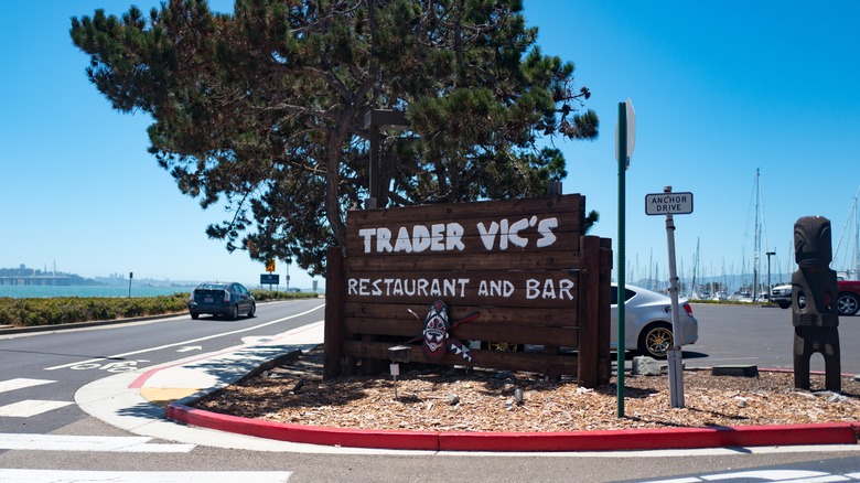 A Trader Vic's wooden sign at entrance