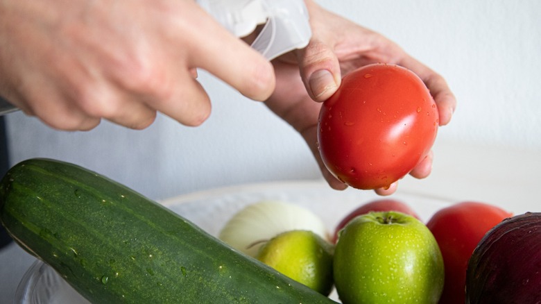 Fruit being vinegar spray cleaned