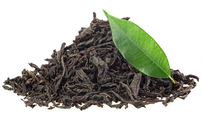 black tea and fresh tea leaf
