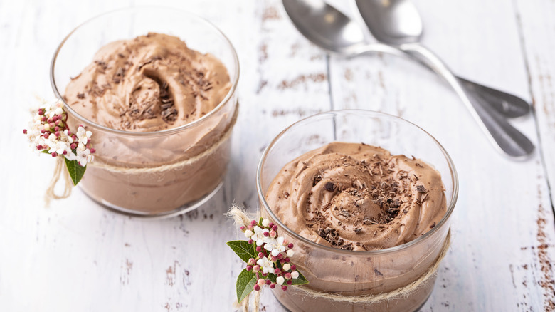 glasses of chocolate mousse on white table