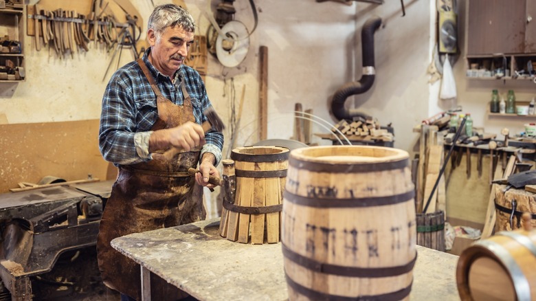 Cooper making bourbon barrels