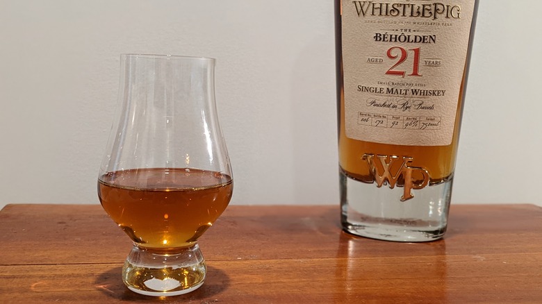 WhistlePig Beholden 21 bottle and glass