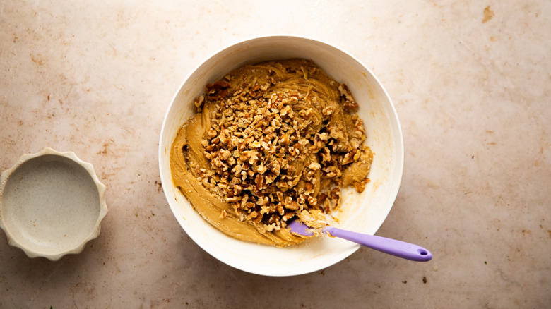 Bowl of dough with walnuts