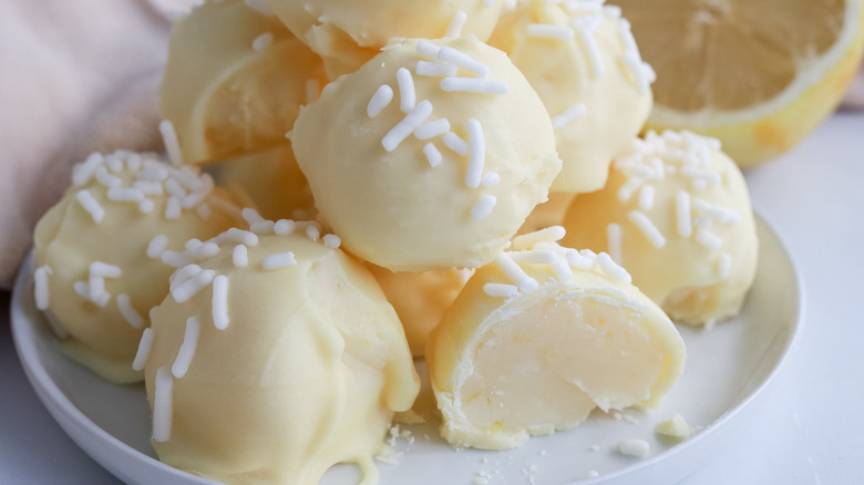 white chocolate lemon truffles on white plate