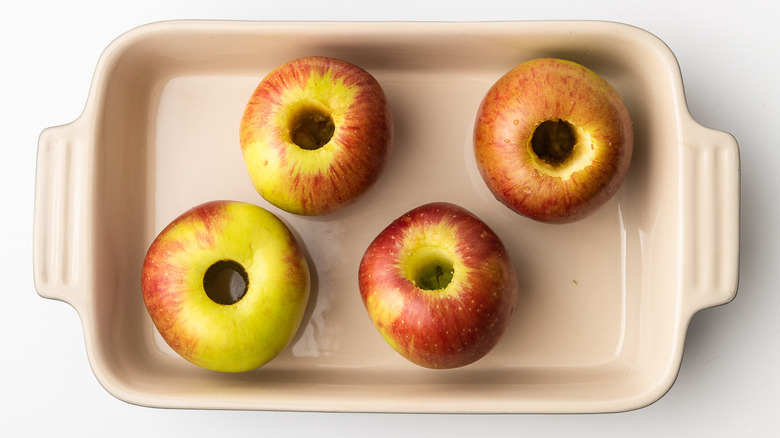 cored apples in dish 