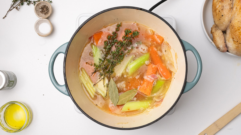 Vegetables and liquids in pan