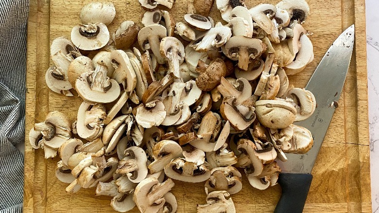 sliced mushrooms on board