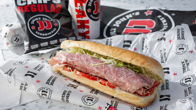 A Jimmy John's combo meal featuring a sandwich, bag of Jimmy Chips, and a drink