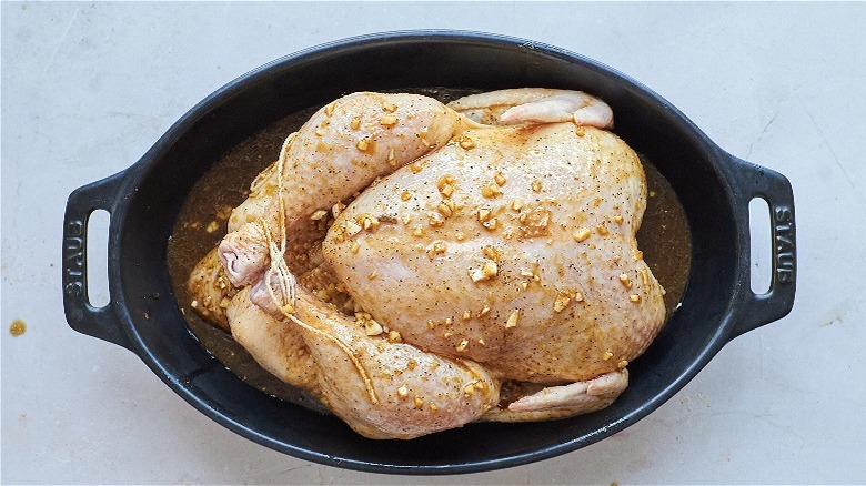 tied chicken in baking dish