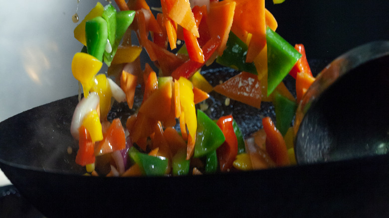 wok stir frying peppers