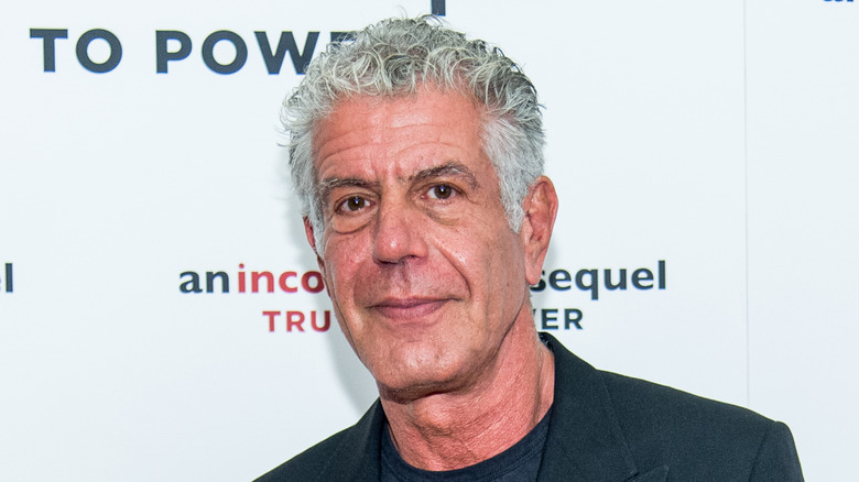 Anthony Bourdain wearing dark blazer