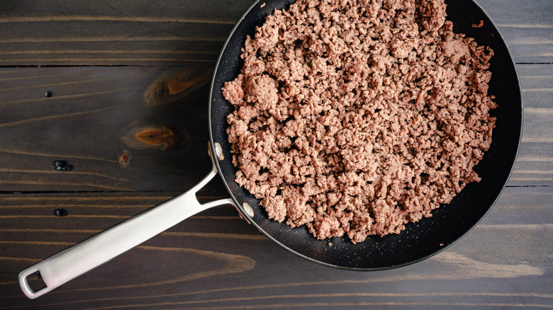 Browned ground beef in skillet