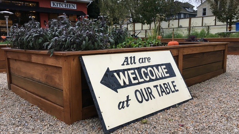 Sign all are welcome restaurant garden box