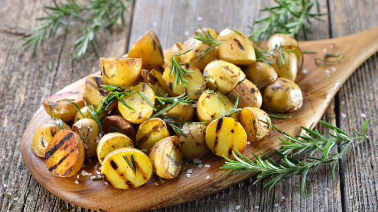 grilled potato halves on serving board