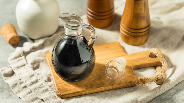 Balsamic vinegar on wooden board