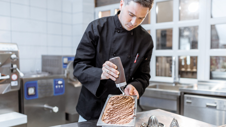 man topping ice cream