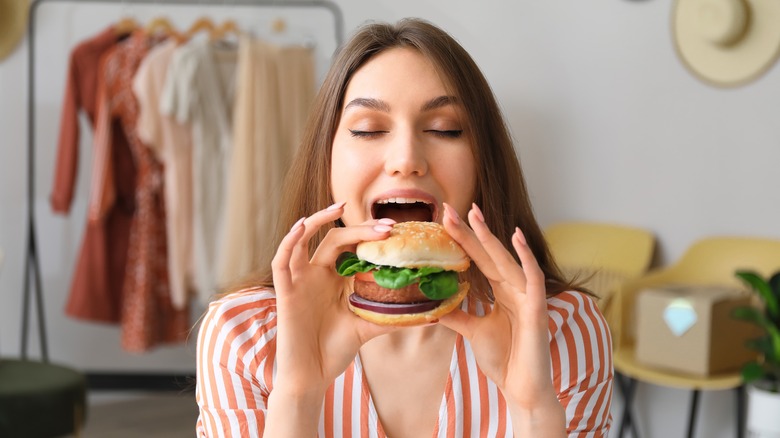 Woman eating vegan burger