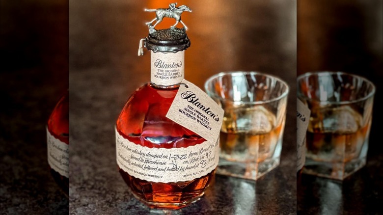 Blanton's bourbon bottle with glass