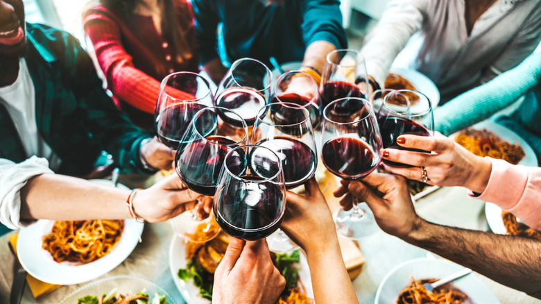 family toasting wine