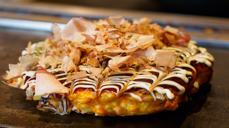 Japanese savory pancake topped with bonito flakes