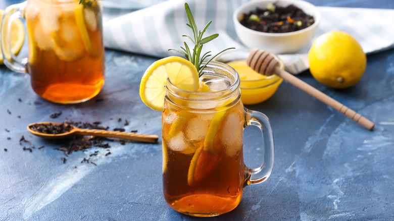 Jar of iced tea with lemon and sprig