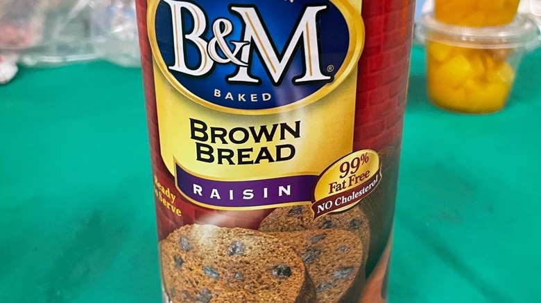 Sliced canned bread next to the can