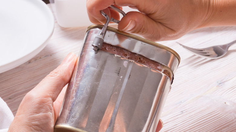 Canned corn beef with key attached to the side