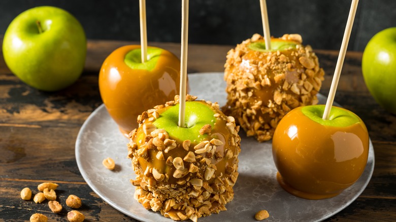Caramel apples rolled in nuts