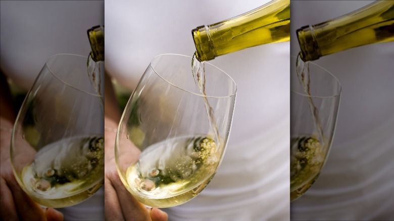 pouring glass of chardonnay