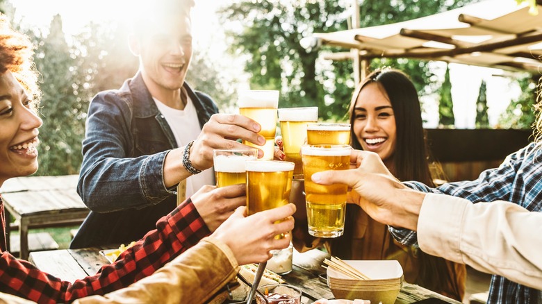 diverse people enjoying their beer 