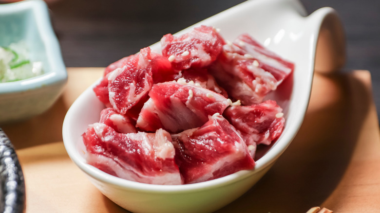 Boneless short ribs in white bowl