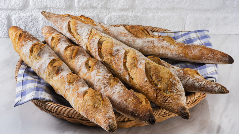 Baguette loaves stacked in bowl