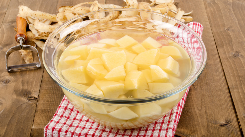 diced potatoes in bowl of water