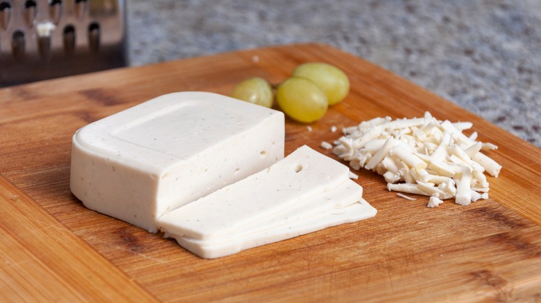 shredded vegan mozzarella on cutting board