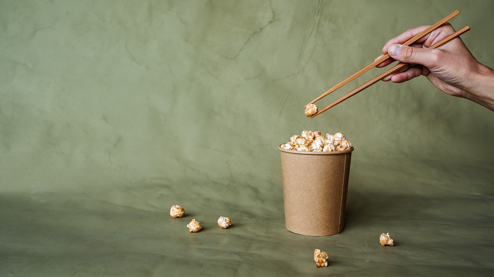 Why Eating Popcorn With Chopsticks May Actually Make It Taste Better