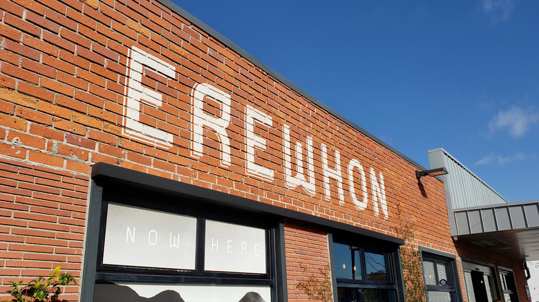 A red-brick Erewhon storefront.