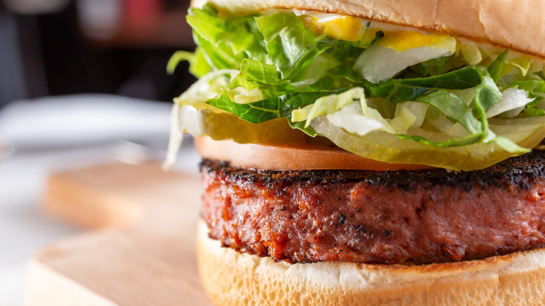 Fake meat burger with toppings on bun 