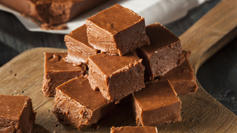 Stack of chocolate fudge on cutting board