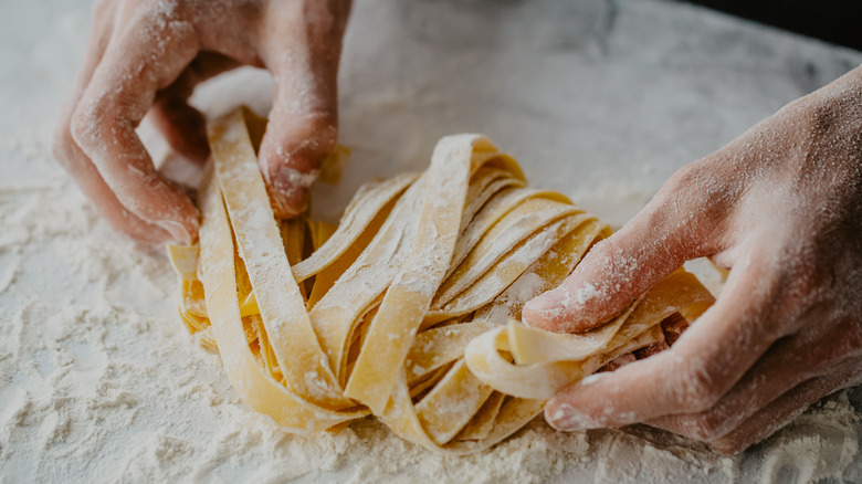 pulling fresh noodles apart