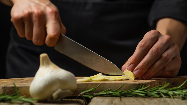 chef chopping garlic