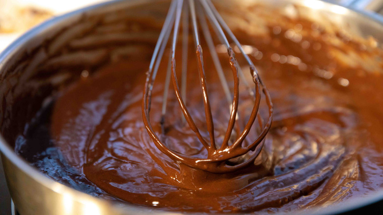 Making brownie batter with whisk