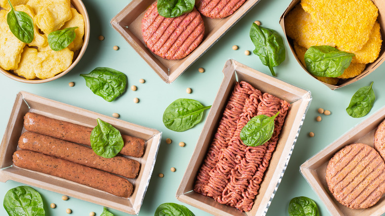 Collection of plant-based fake meat including hot dogs and patties