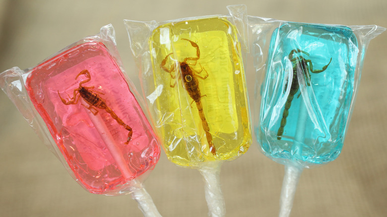 Three scorpion lollipops