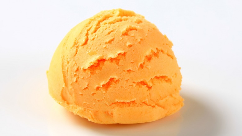 Close-up of a scoop of orange sherbet