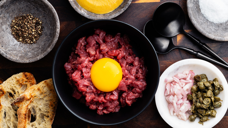 Ingredients for steak tartare on table